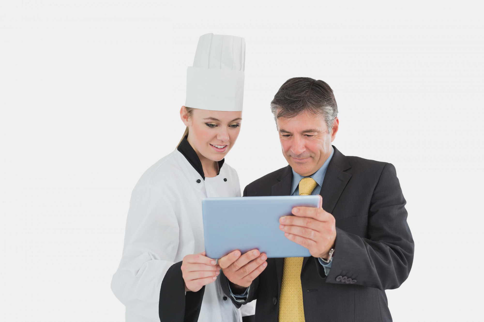 consultation in a compact kitchen with chef and planner