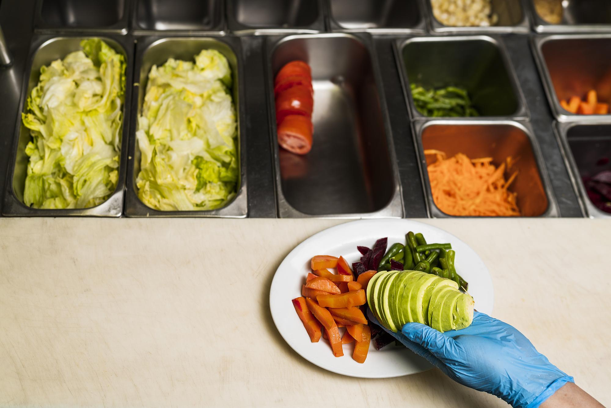 prep station with labeled mise en place trays